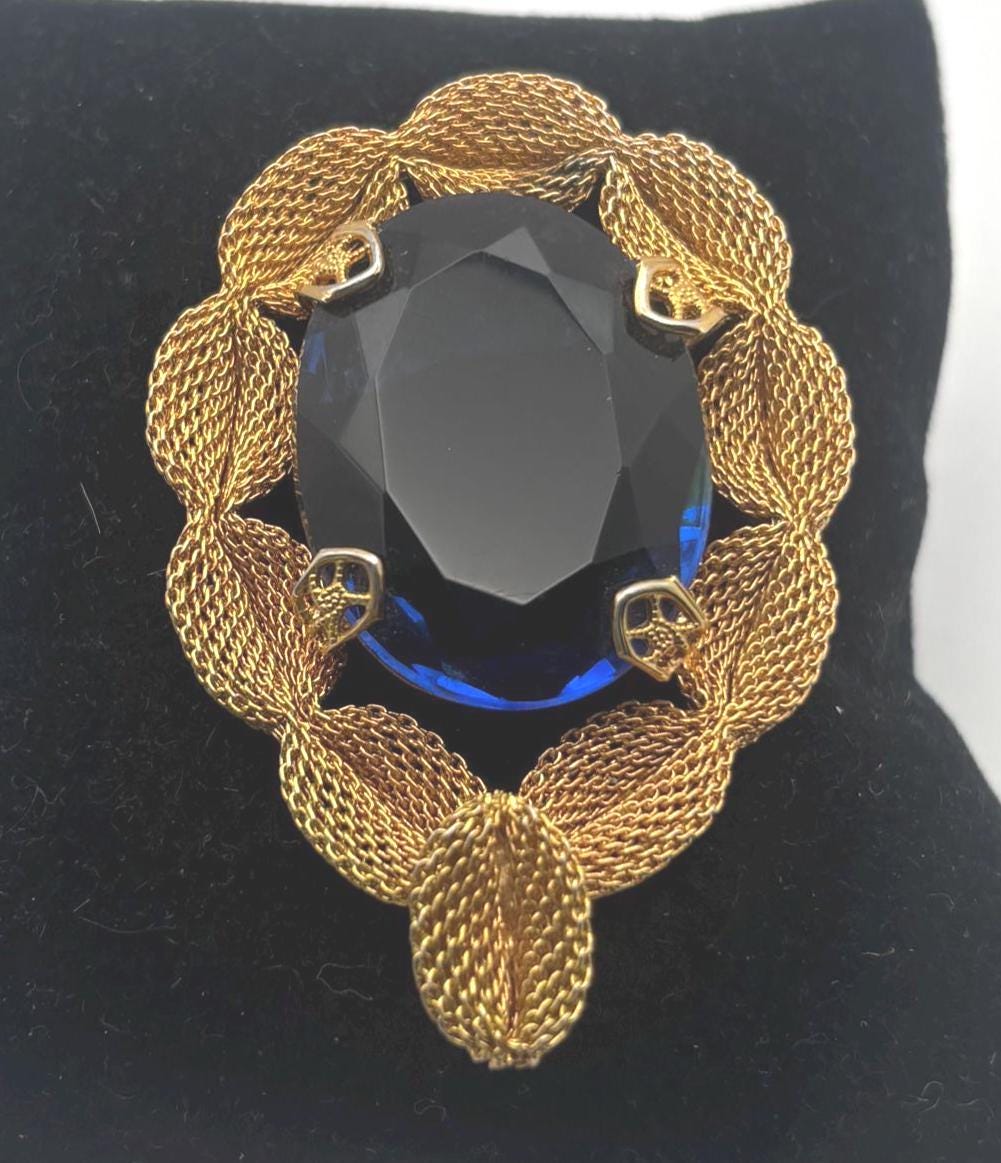Gold Tone Mesh Brooch with Large Blue Crystal Stone
