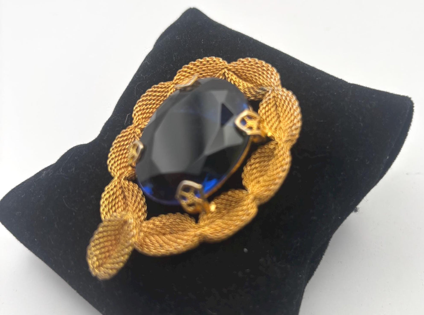 Gold Tone Mesh Brooch with Large Blue Crystal Stone