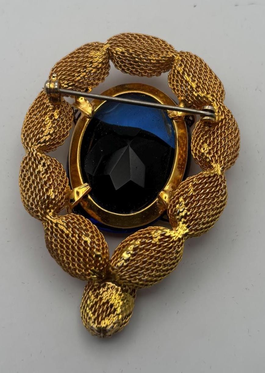 Gold Tone Mesh Brooch with Large Blue Crystal Stone