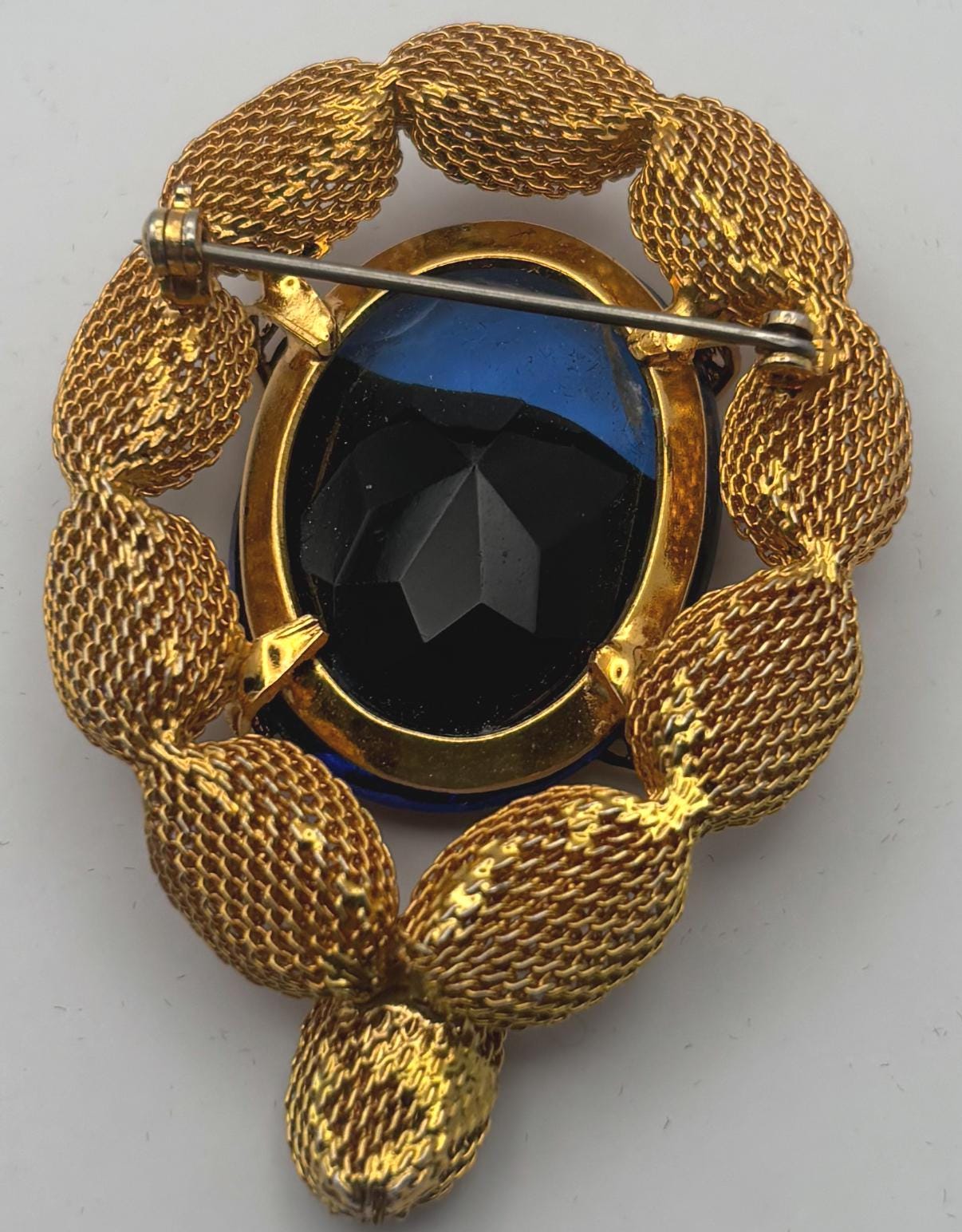 Gold Tone Mesh Brooch with Large Blue Crystal Stone