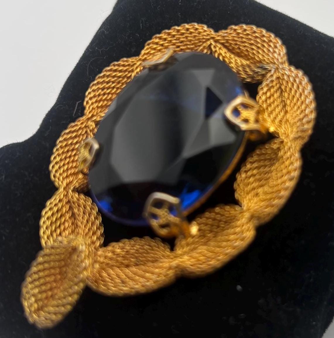 Gold Tone Mesh Brooch with Large Blue Crystal Stone
