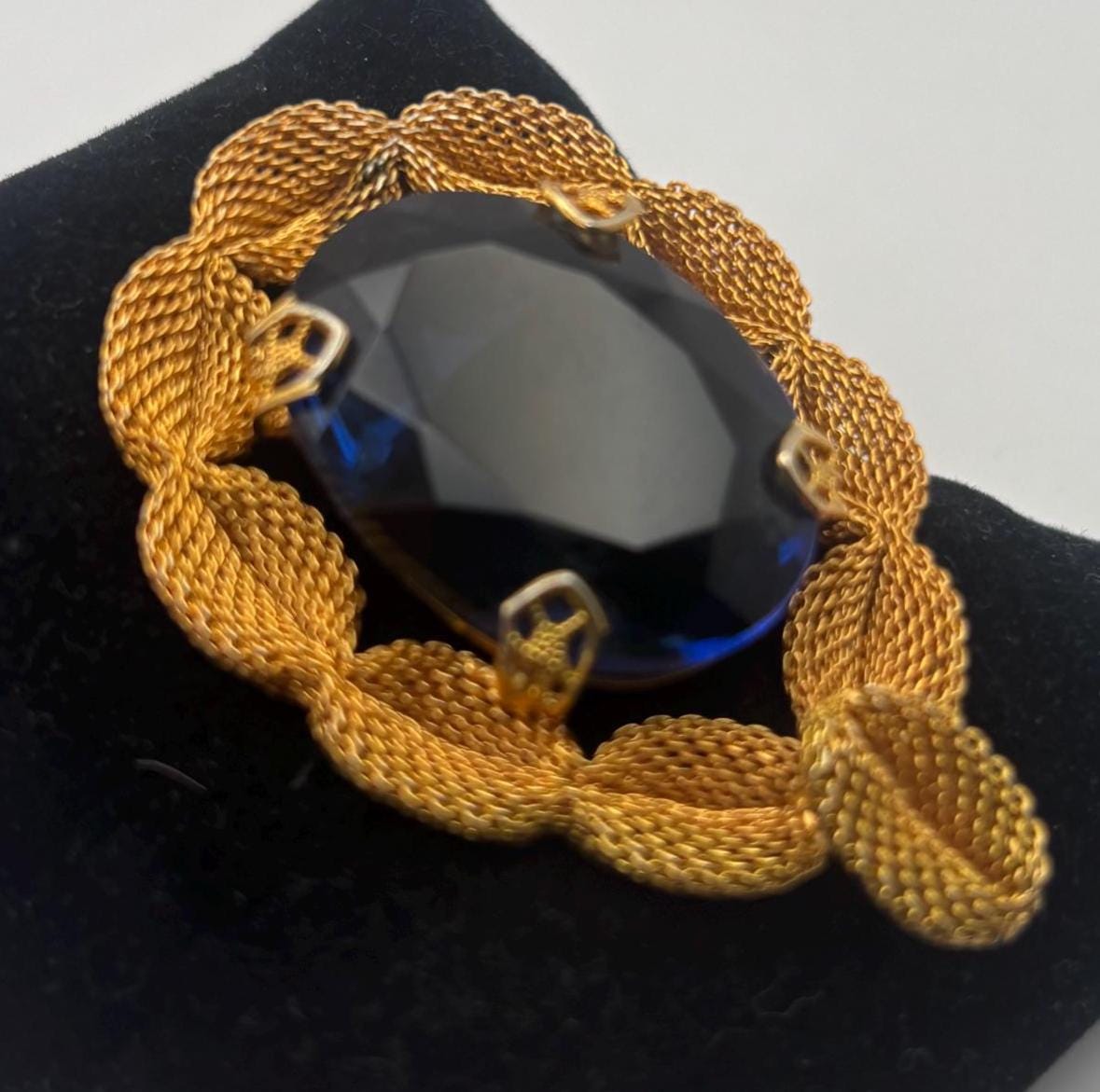 Gold Tone Mesh Brooch with Large Blue Crystal Stone