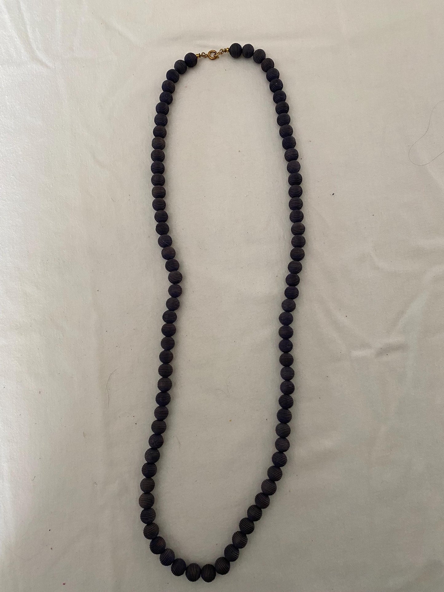 Vintage Black Beaded Long Necklace with Striations Giving it a Mid Century Vibe Necklace Unique Gifts at Lover Antiques and Vintage