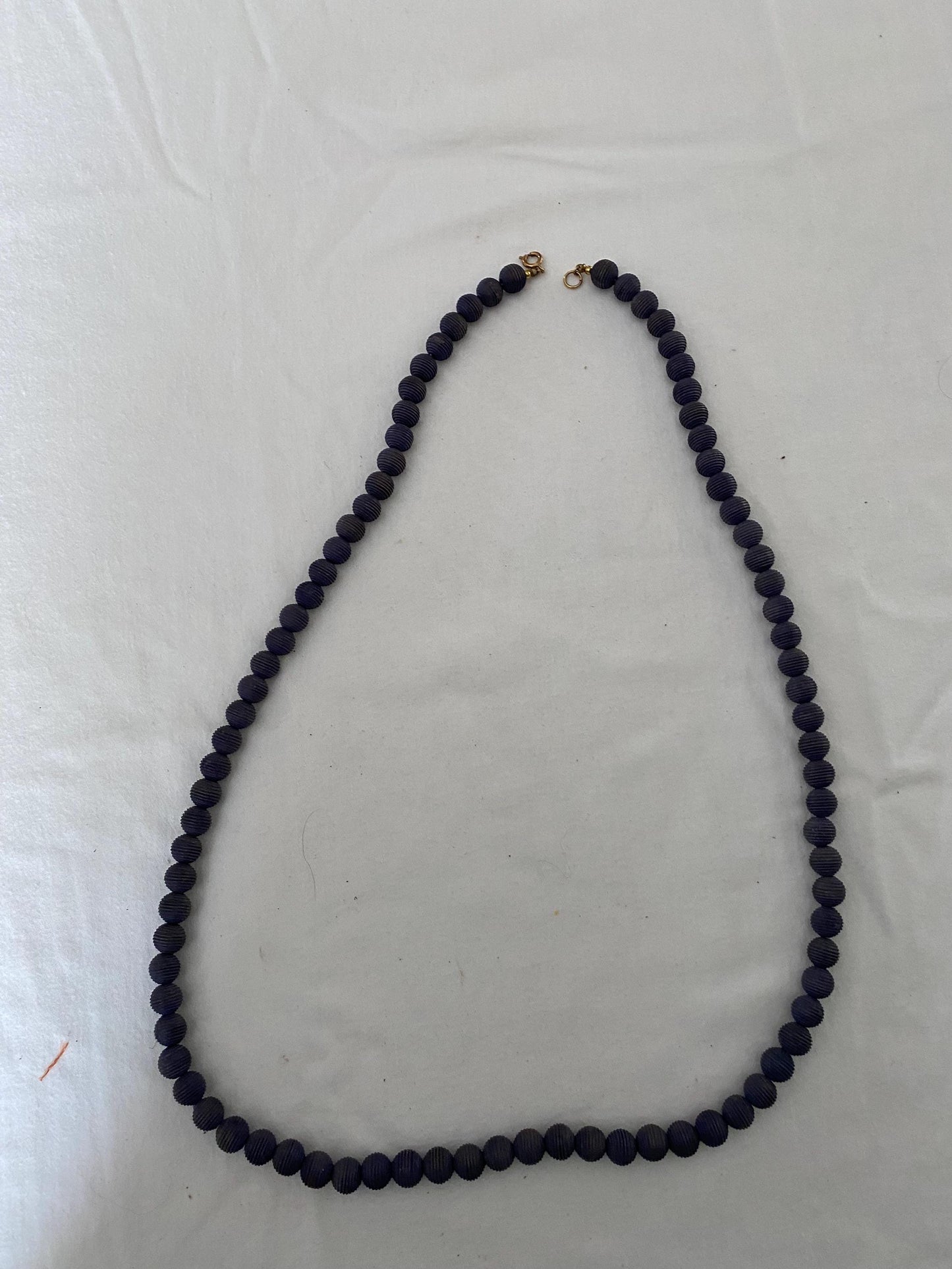 Vintage Black Beaded Long Necklace with Striations Giving it a Mid Century Vibe Necklace Unique Gifts at Lover Antiques and Vintage