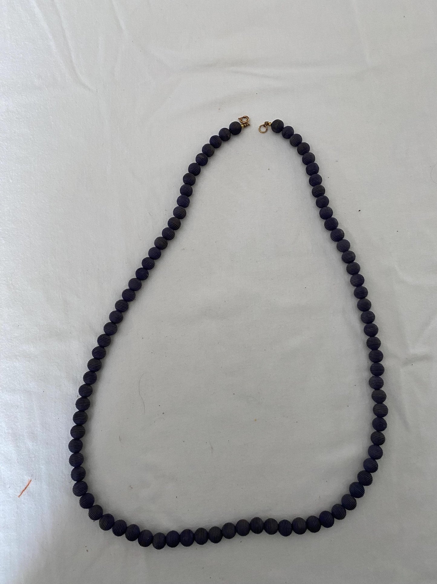 Vintage Black Beaded Long Necklace with Striations Giving it a Mid Century Vibe Necklace Unique Gifts at Lover Antiques and Vintage