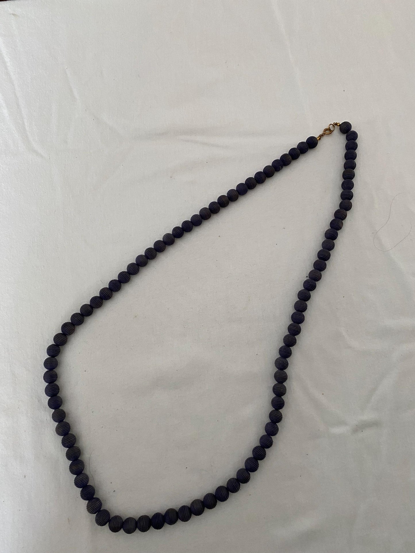 Vintage Black Beaded Long Necklace with Striations Giving it a Mid Century Vibe Necklace Unique Gifts at Lover Antiques and Vintage