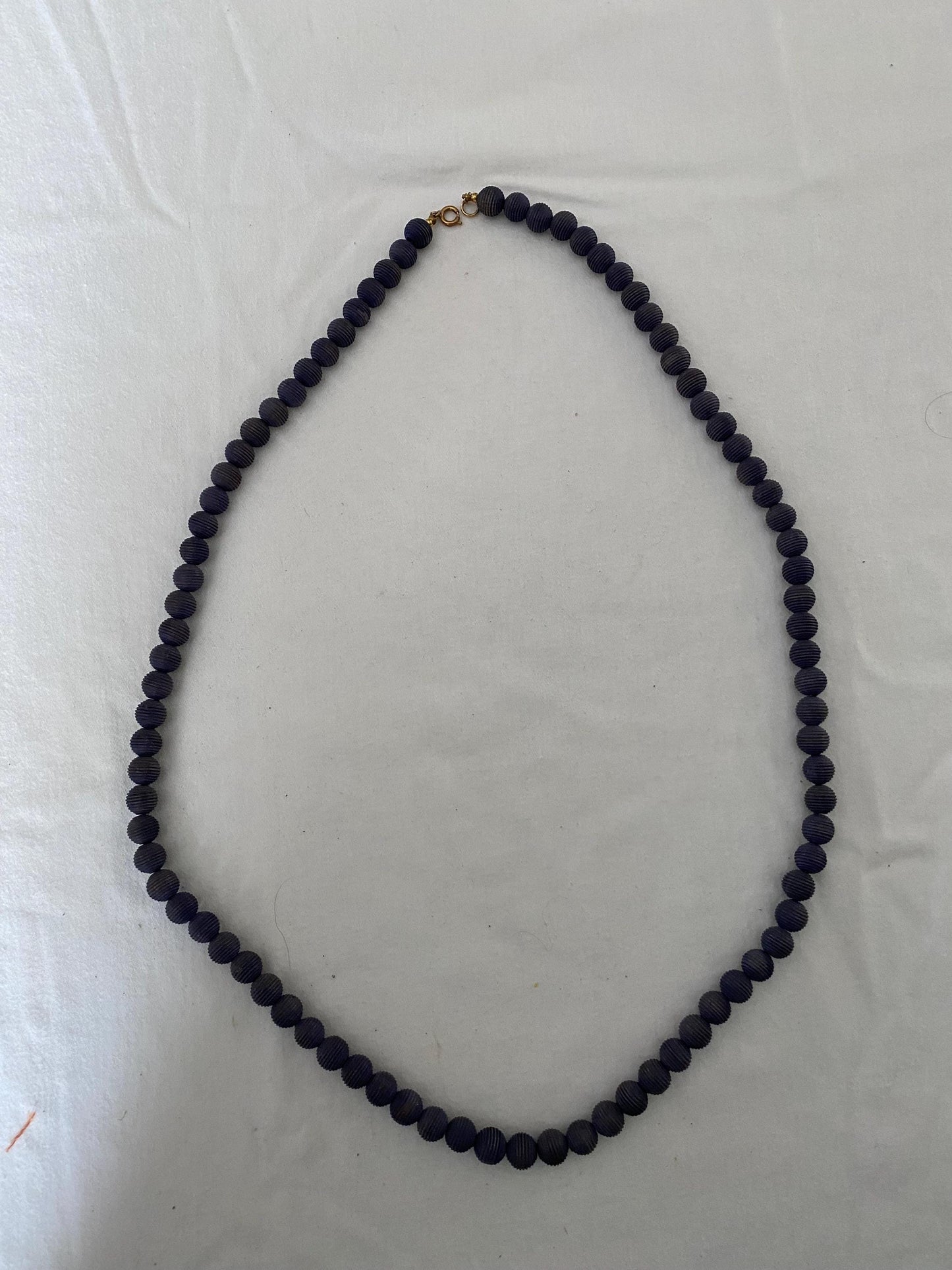 Vintage Black Beaded Long Necklace with Striations Giving it a Mid Century Vibe Necklace Unique Gifts at Lover Antiques and Vintage