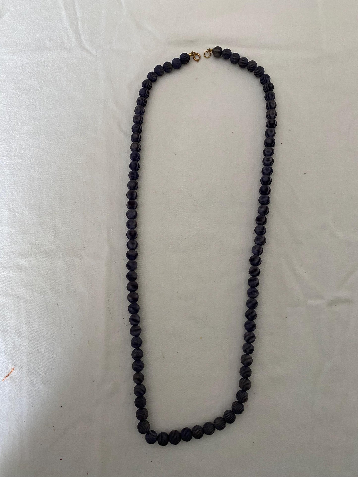 Vintage Black Beaded Long Necklace with Striations Giving it a Mid Century Vibe Necklace Unique Gifts at Lover Antiques and Vintage